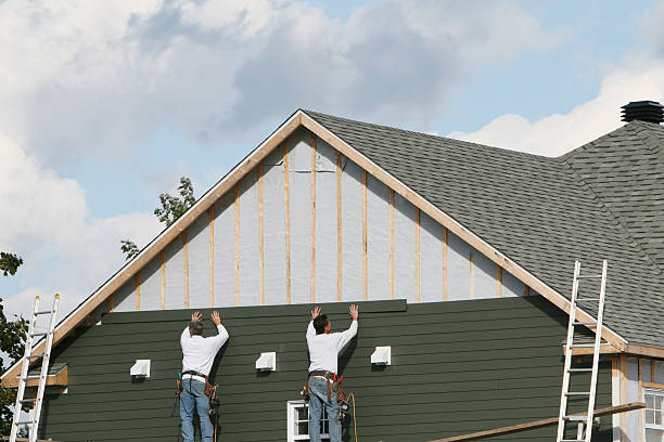 Professional Storm Damage Siding Repair technician working in Liberty, KY